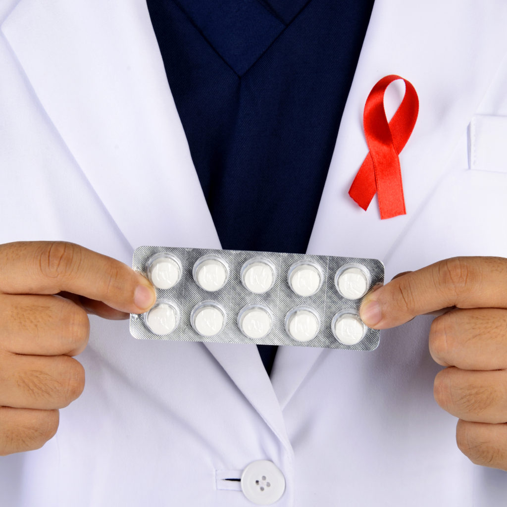 Doctor Hand Holding Cure For AIDS